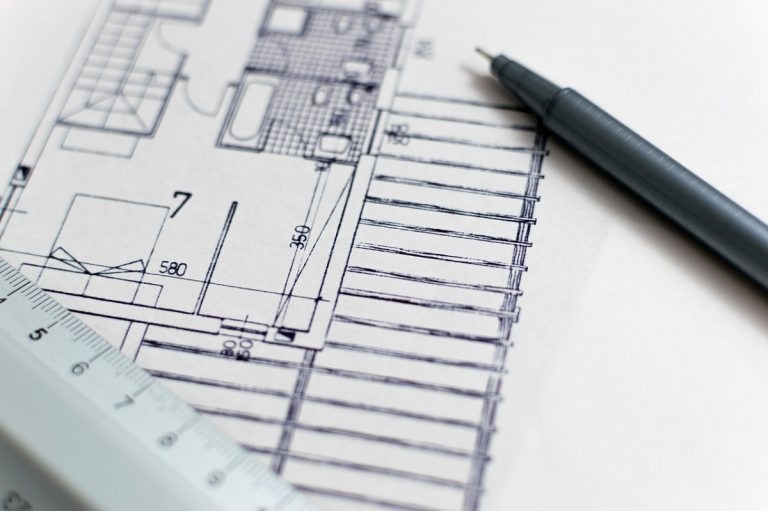 pen and a drawing of electrical plan