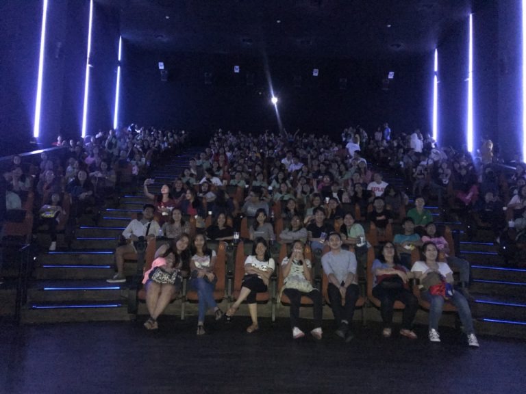 photo inside a cinema with people watching
