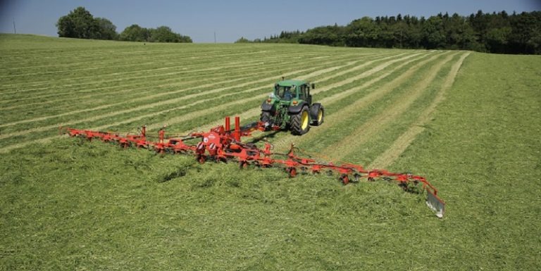 farm tractor cutting the field