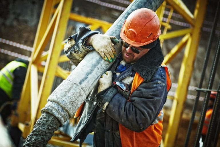 construction worker carrying material
