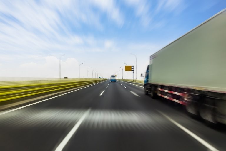 truck speeding through a highway