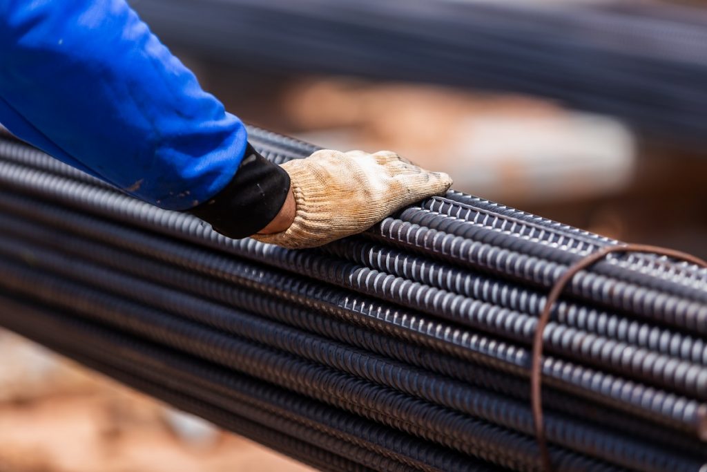 man holding a set of rebar