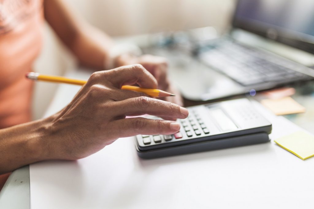person calculating costs
