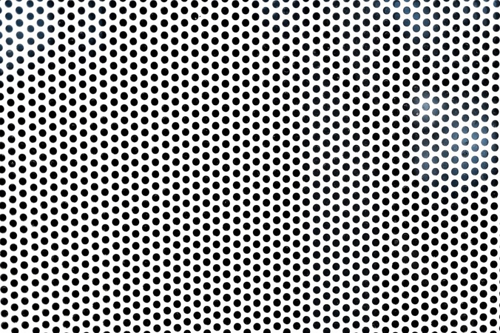 Background sheet of metal with circular holes