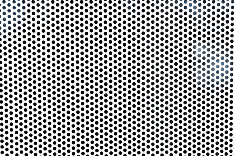 Background sheet of metal with circular holes