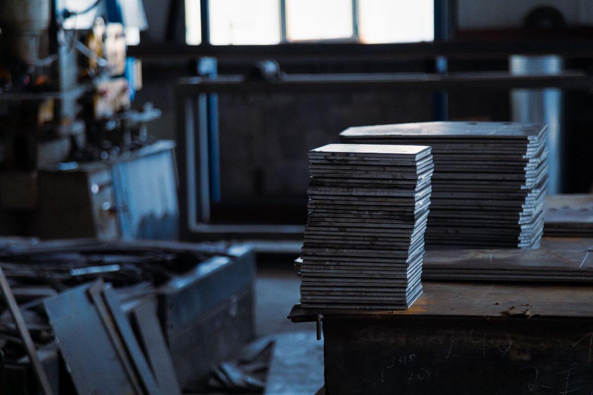 Stacked MS plates stored in a fabrication shop for project supply